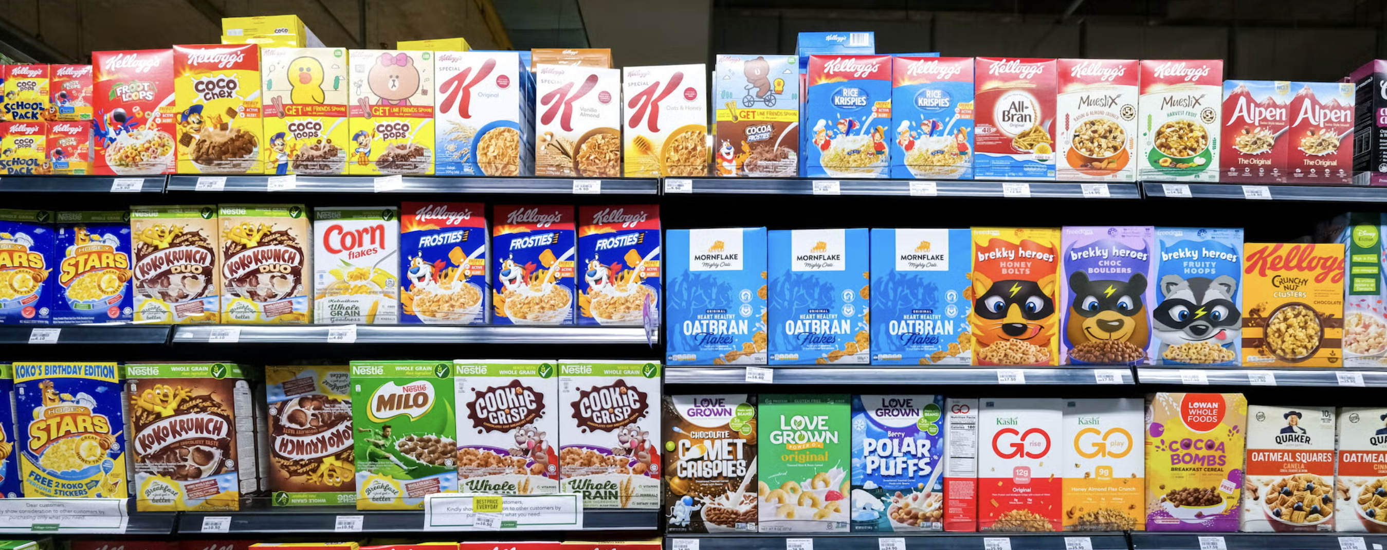 A supermarket shelf of breakfast cereals